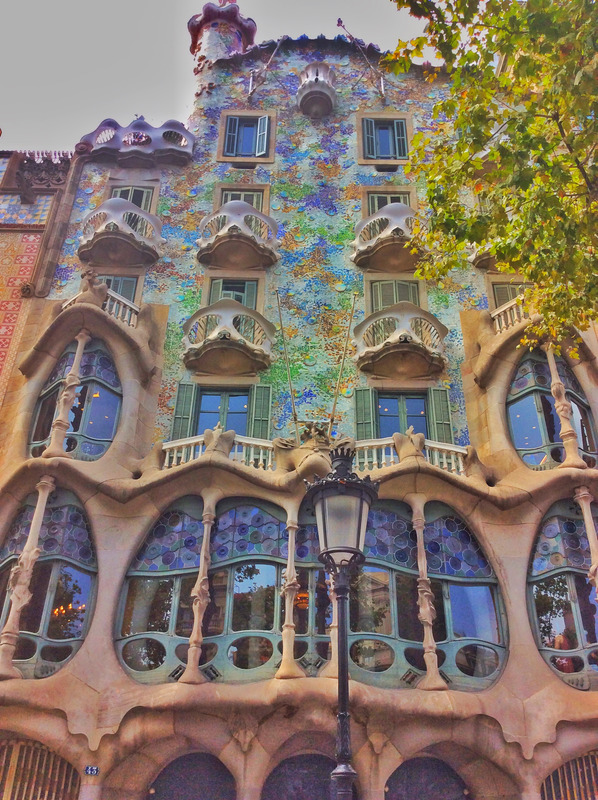 Casa Batlló with many windows and a lamp post