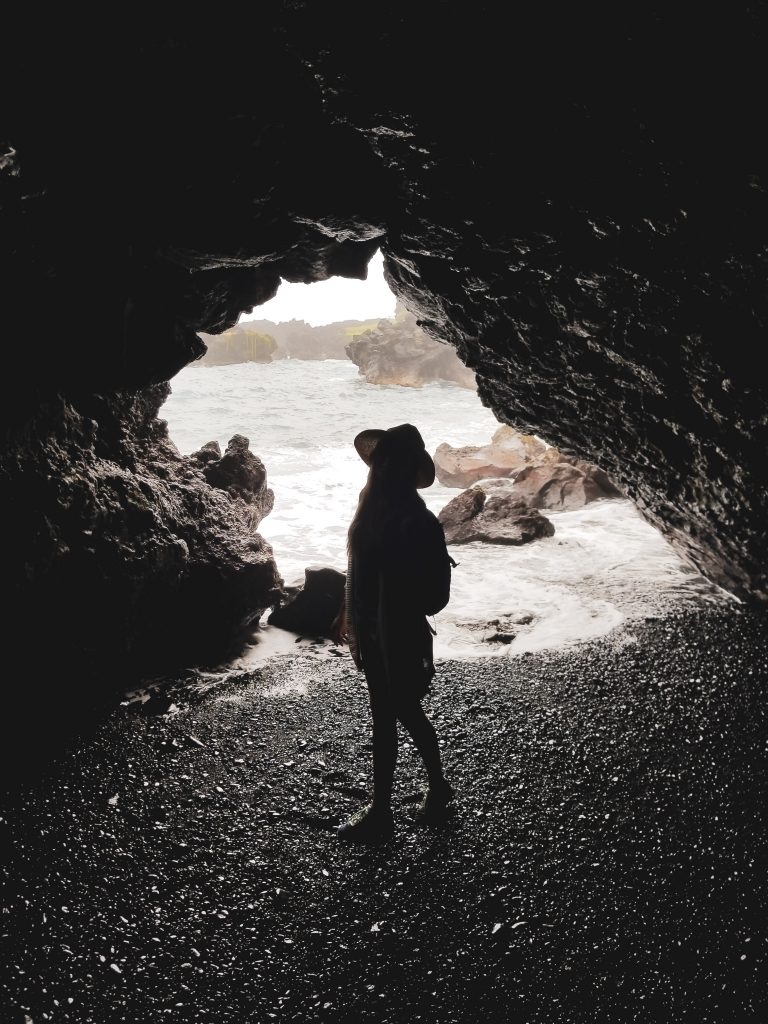 a person standing in a cave