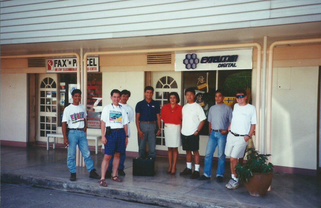a group of people standing outside a store