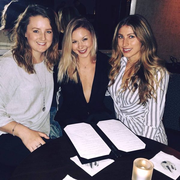 a group of women sitting at a table