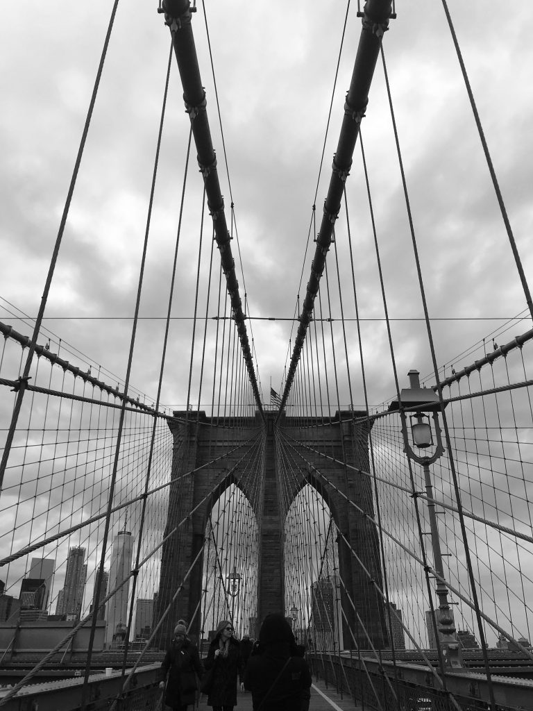 Dramatic photo of the Brooklyn Bridge at night