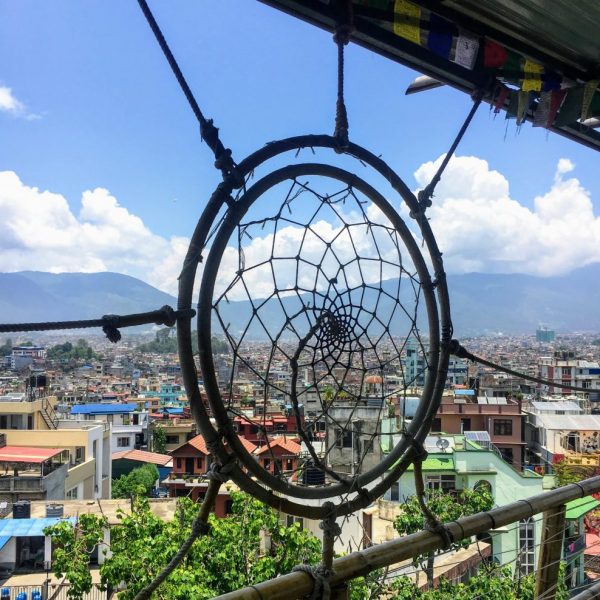 a dream catcher from a balcony