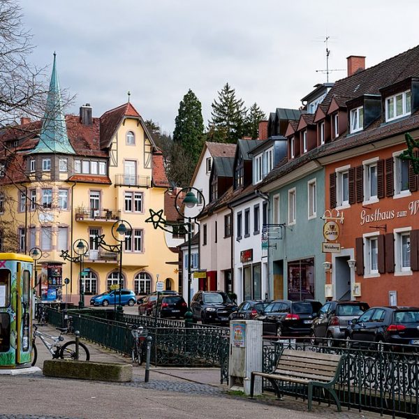 a street with buildings and cars