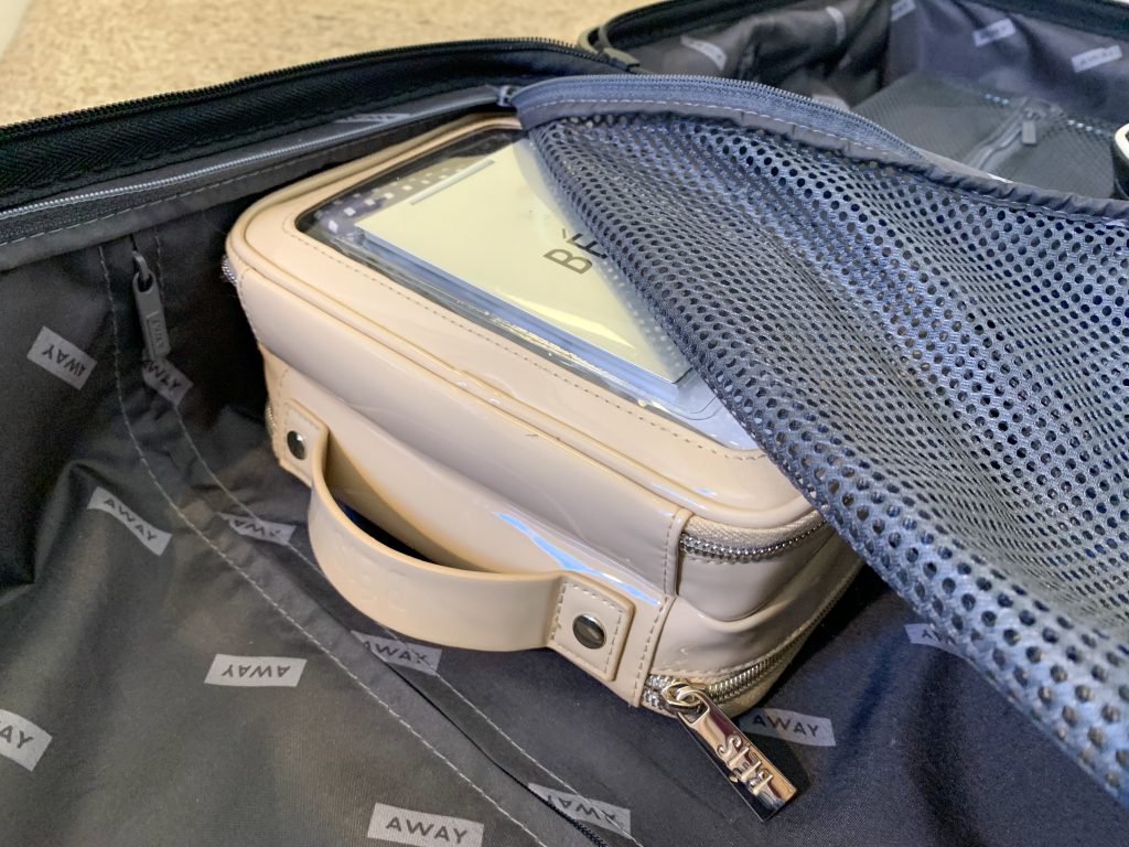 a bag with a clear plastic case inside