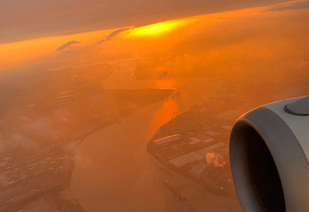 an aerial view of a river and a city