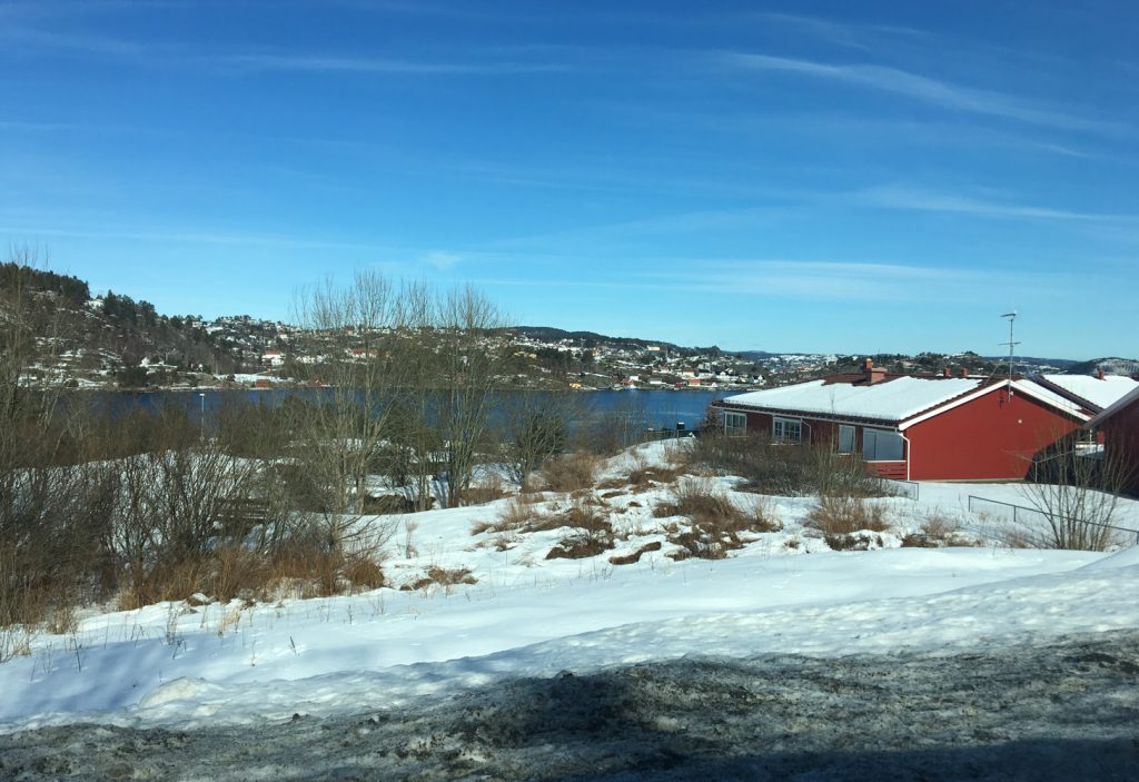 a red house on a snowy hill