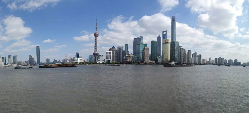 a city skyline with a body of water