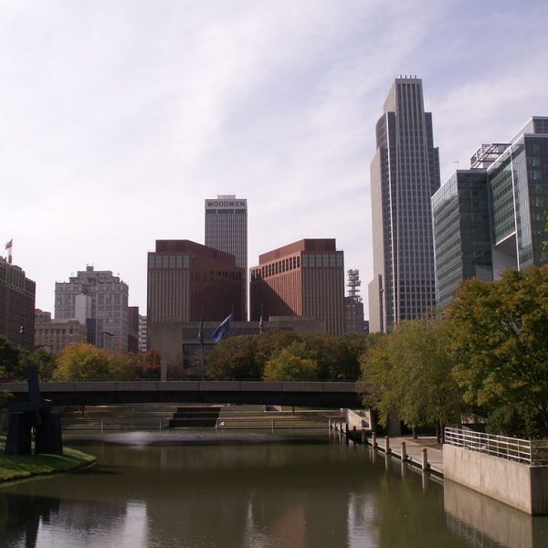 a river with a bridge over a city