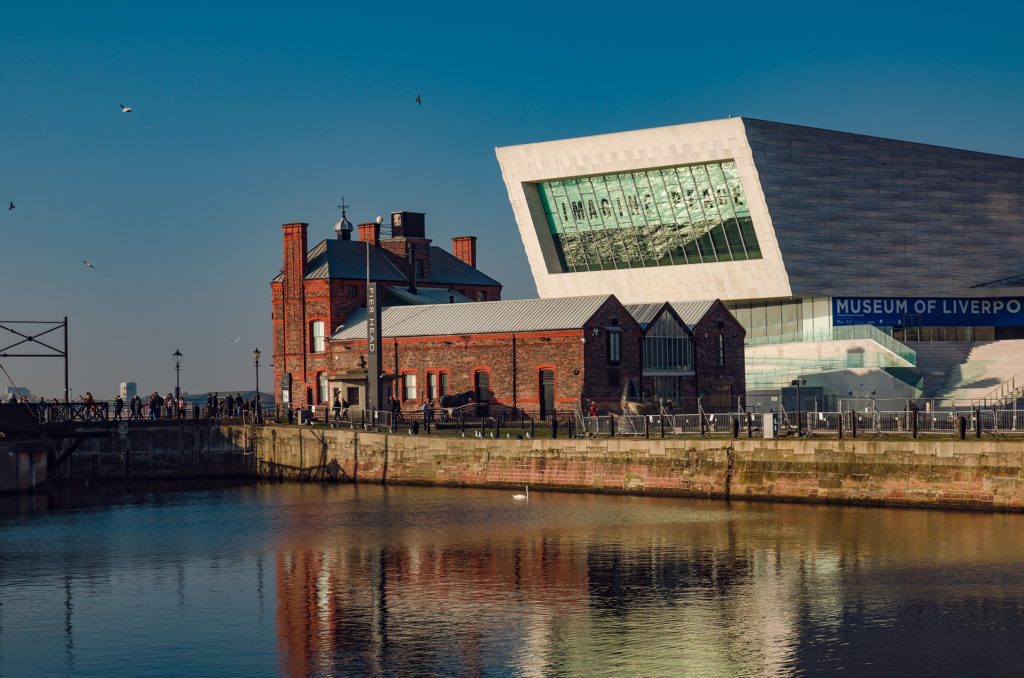 a building next to a body of water