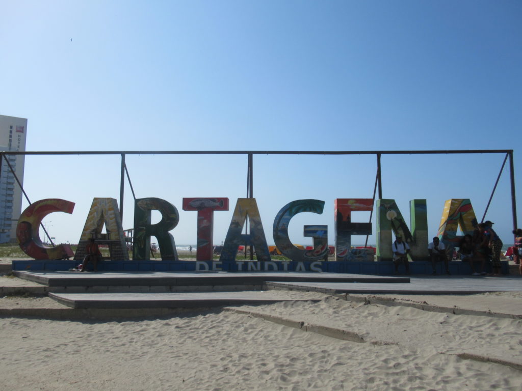 a sign on a beach