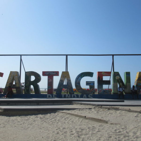 a sign on a beach