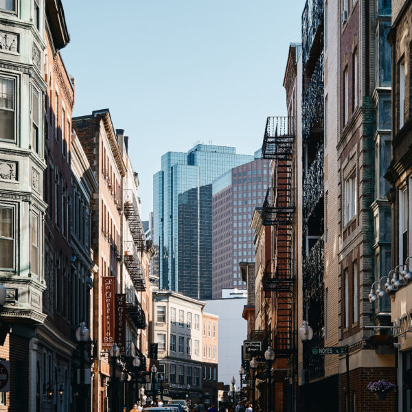 a street with buildings and people in the background