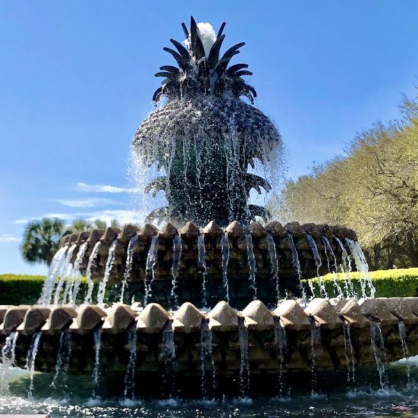 a water fountain with a pineapple shaped fountain