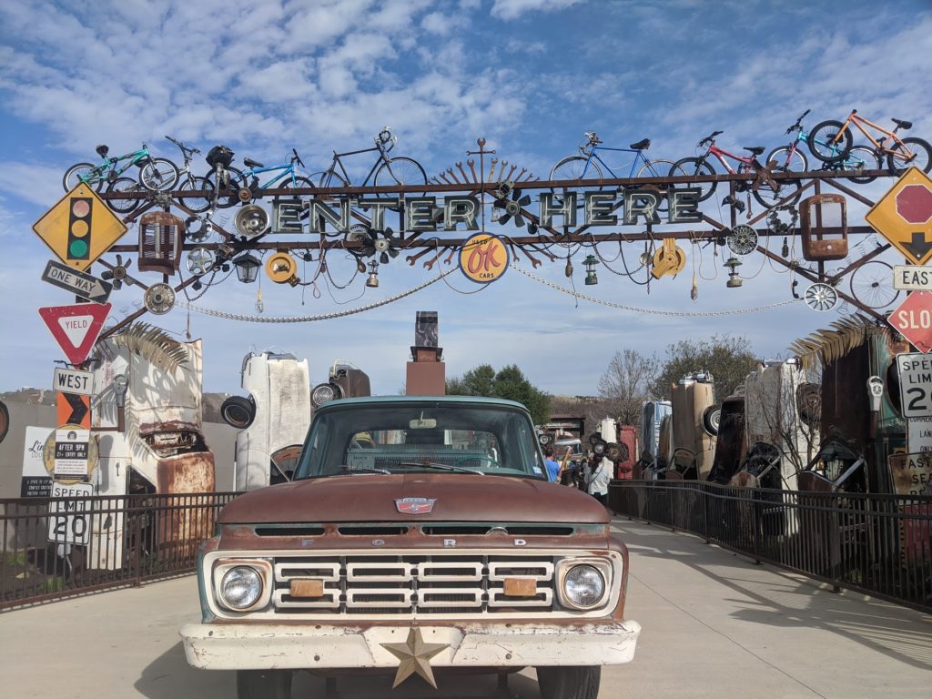 a car parked under a sign