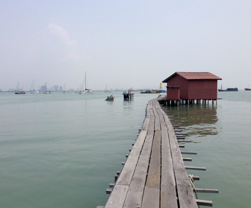 a dock leading to a building