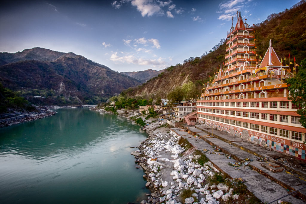 a building next to a river