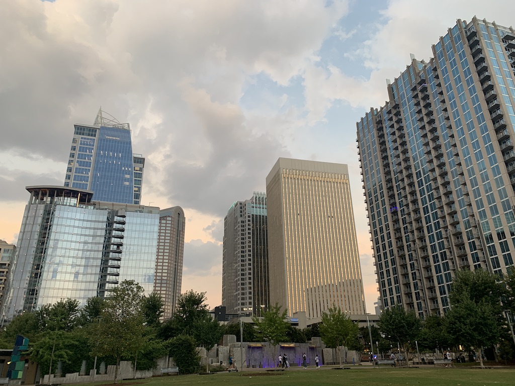 a group of tall buildings in a park