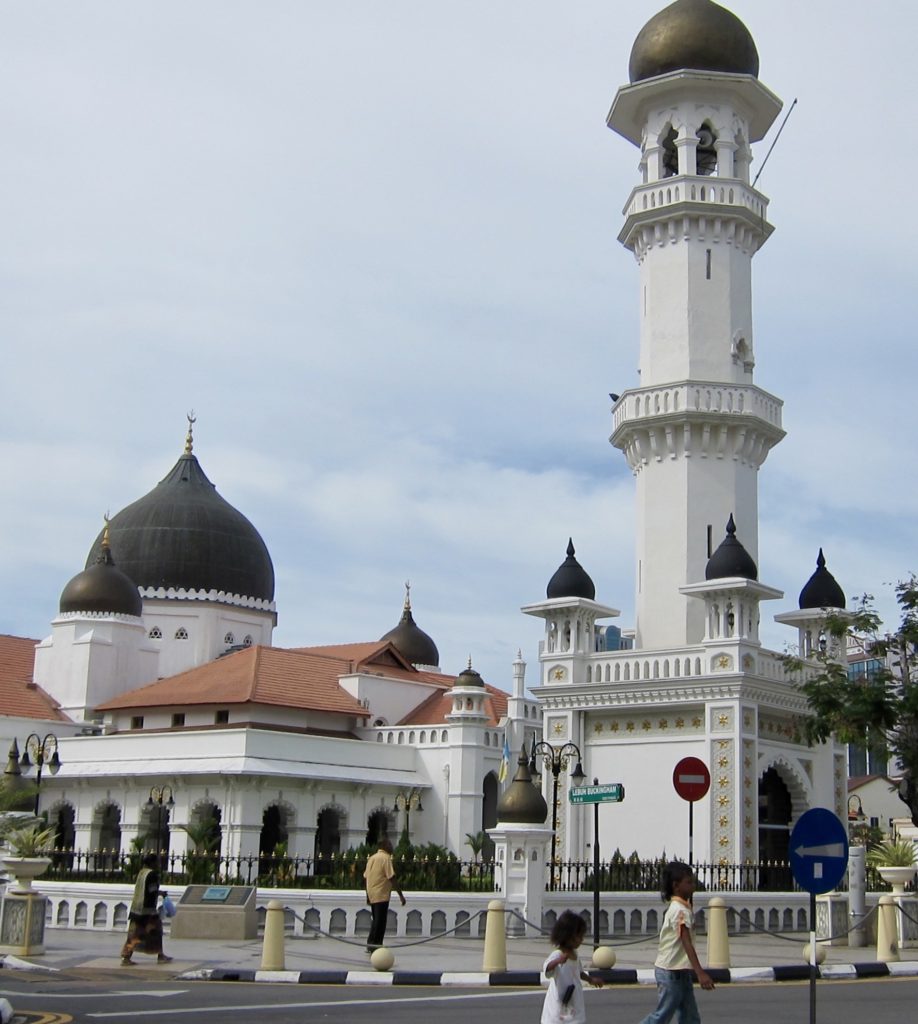 a white building with black domes