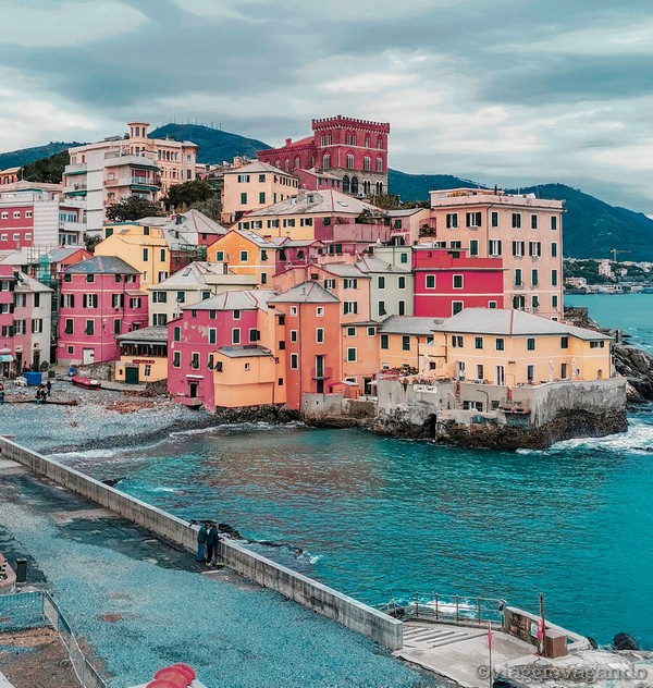a colorful buildings on a rocky shore