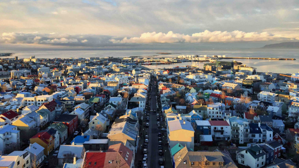 a city with many buildings and a body of water