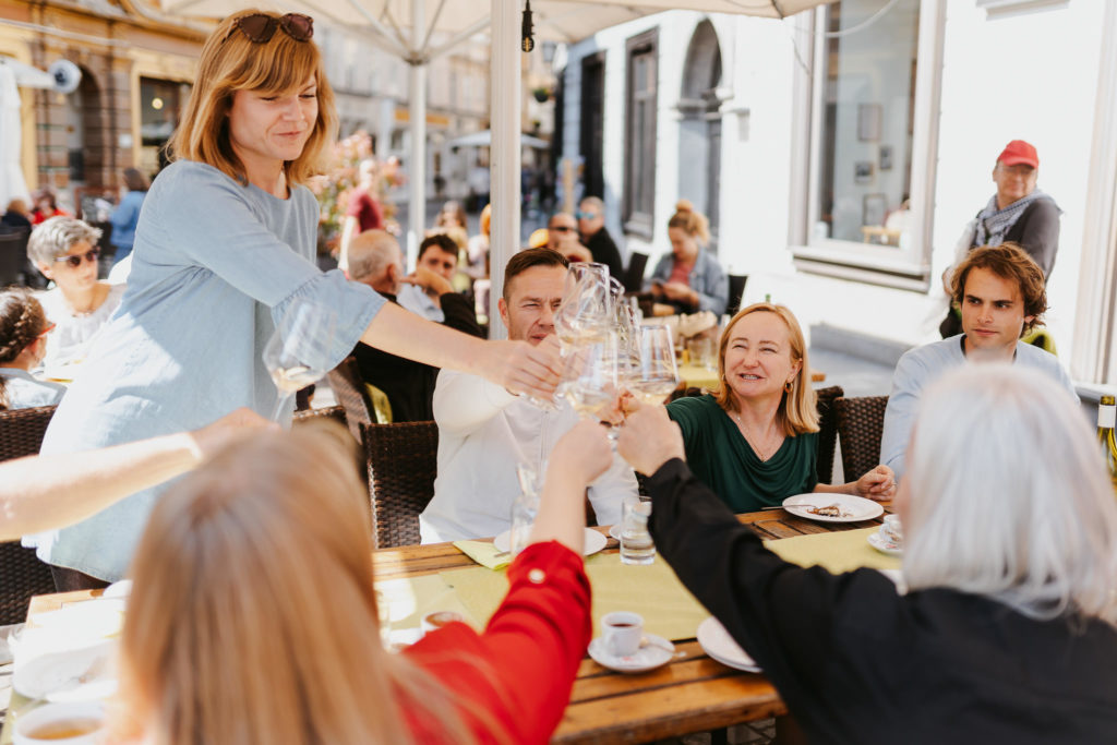 a group of people sitting at a table with drinks