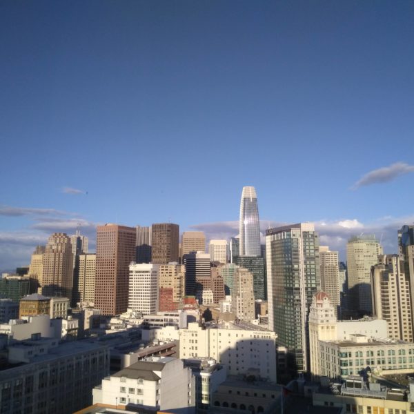 a city skyline with many tall buildings