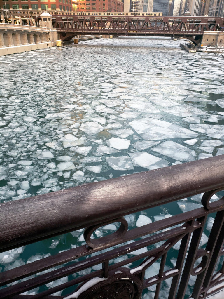 a bridge over a frozen river