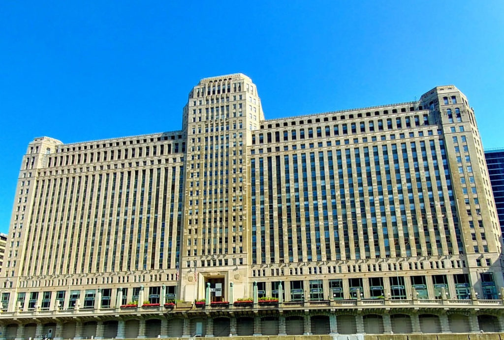a large building with many windows with Merchandise Mart in the background