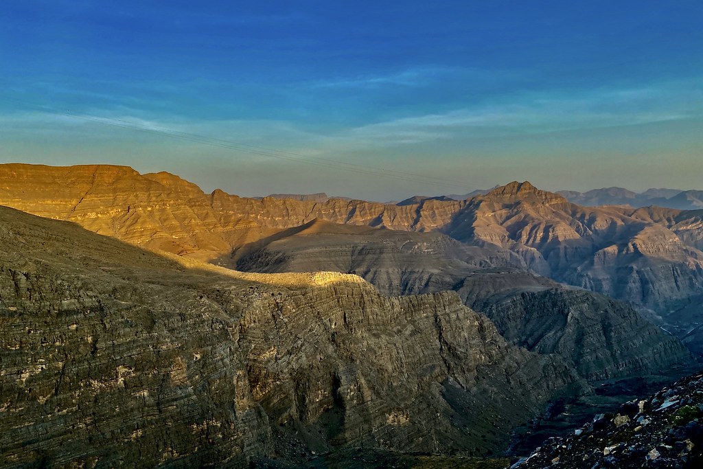 a large rocky mountains with blue sky