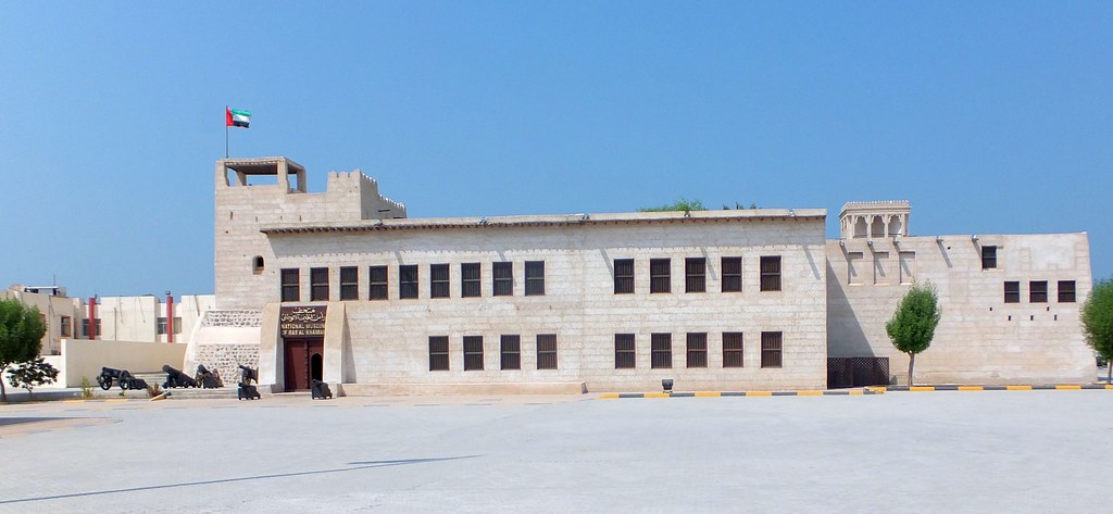 a building with a tower and a gate