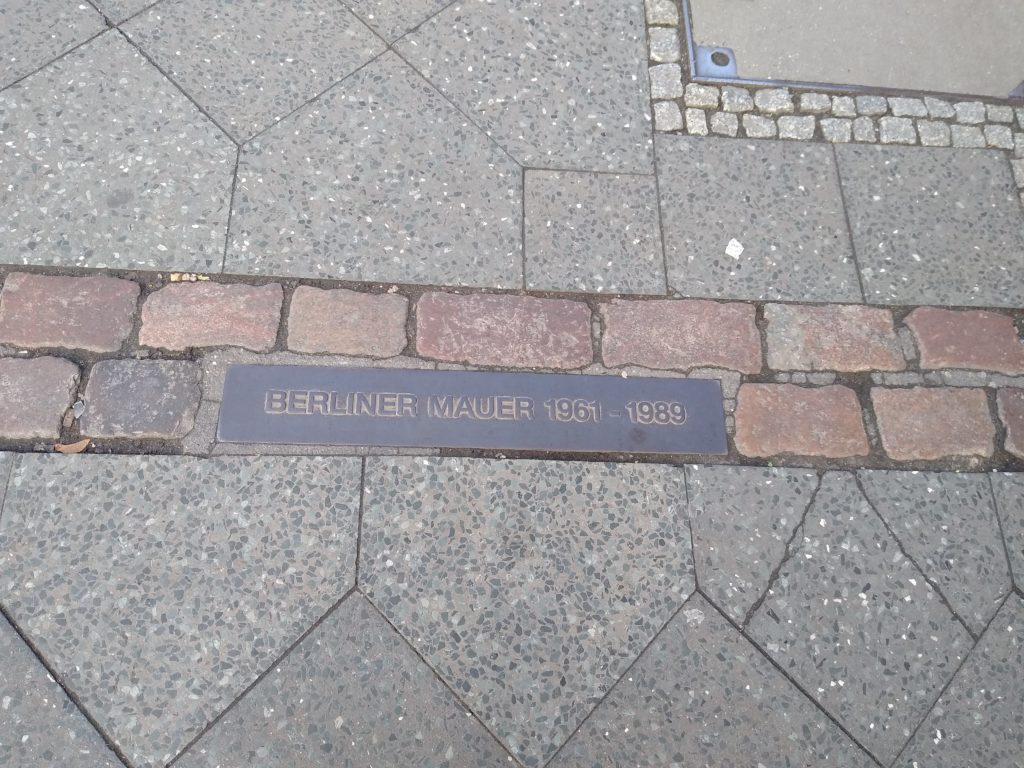 a stone walkway with a plaque