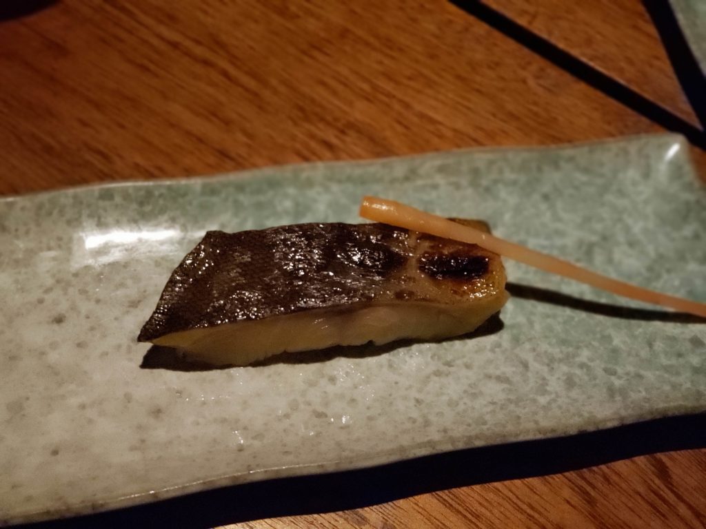 a piece of fish on a plate