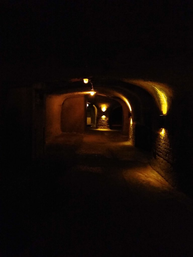 a dark tunnel with lights