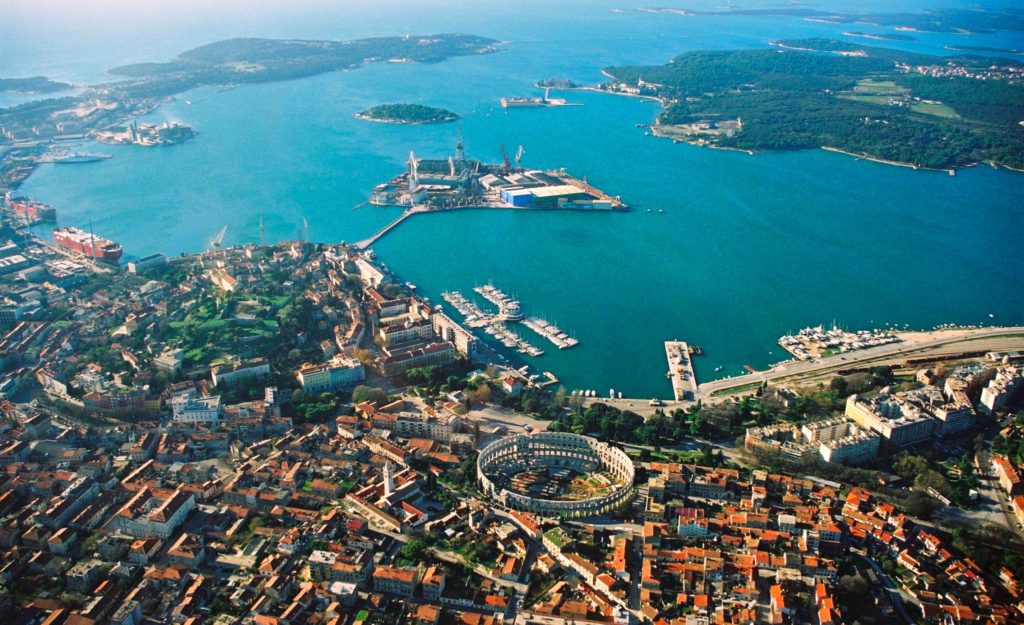 an aerial view of a city and water