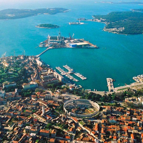 an aerial view of a city and a body of water