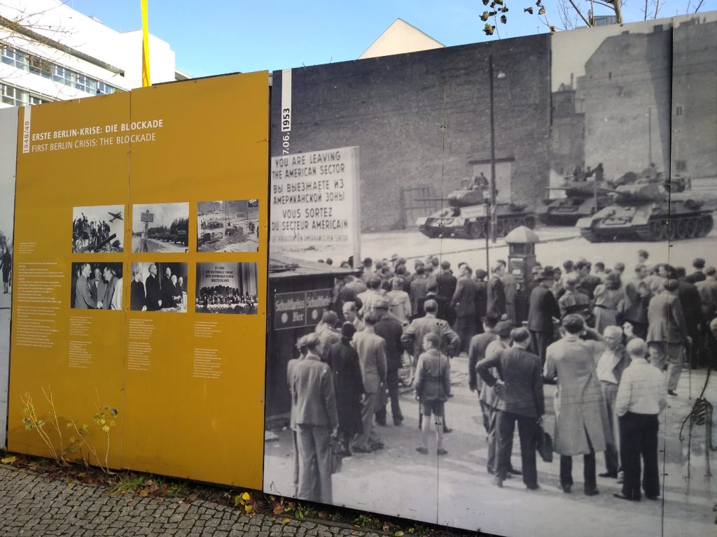 a large black and white photo of a crowd of people