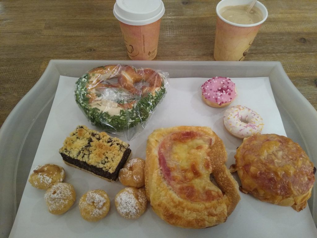 a tray of pastries and coffee