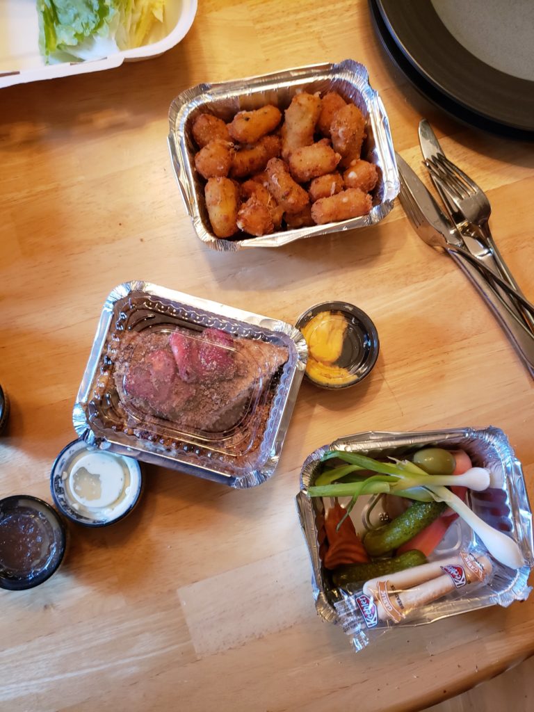 foil trays of food on a table