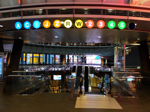 a building with escalators and a sign