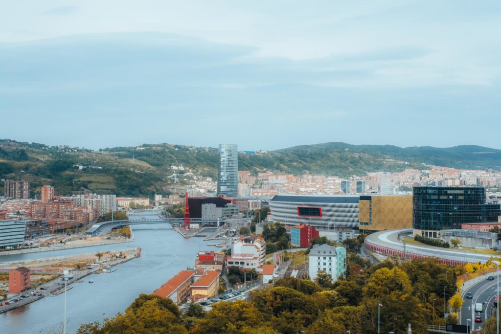 a city with a river and trees