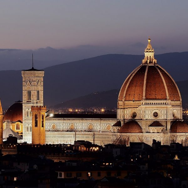 a large building with a dome and towers