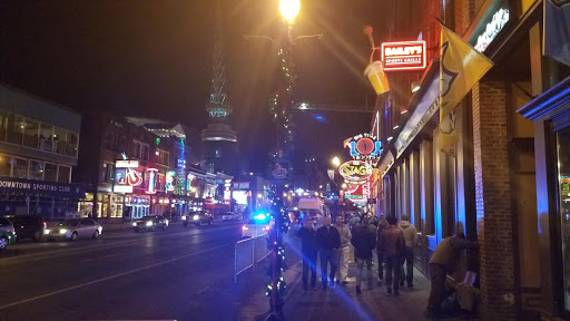 a group of people walking on a street