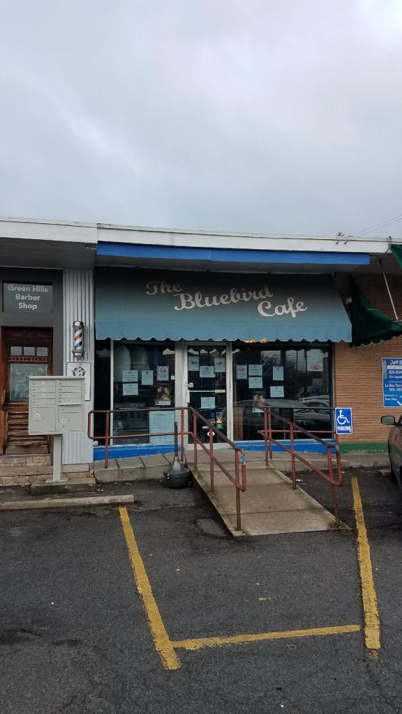 a building with a ramp leading to a store