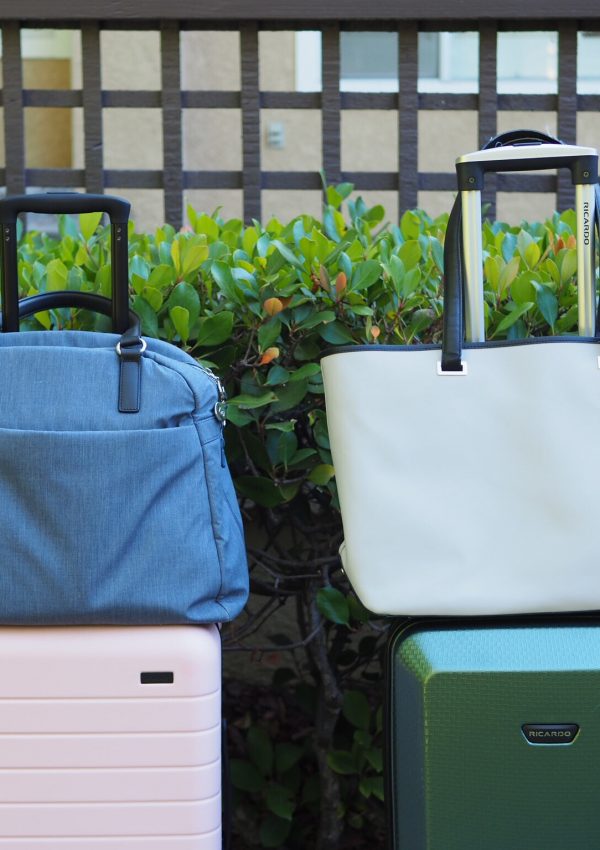 a group of luggage bags on top of each other