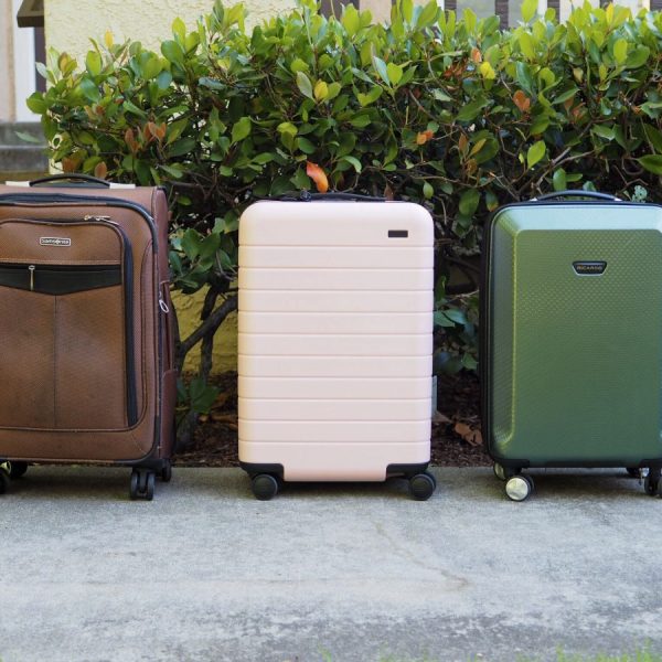 a group of luggage on the sidewalk